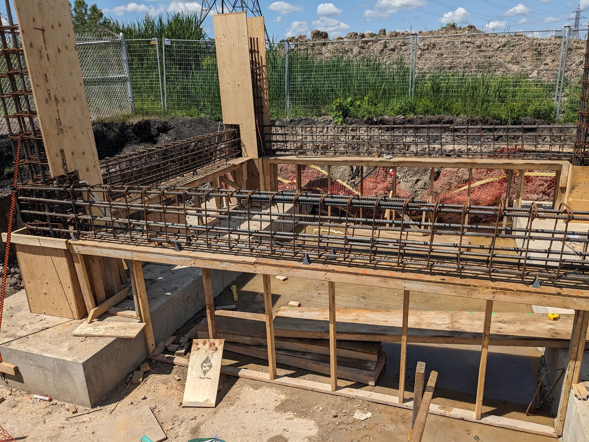 A construction site with a lot of wood and metal.