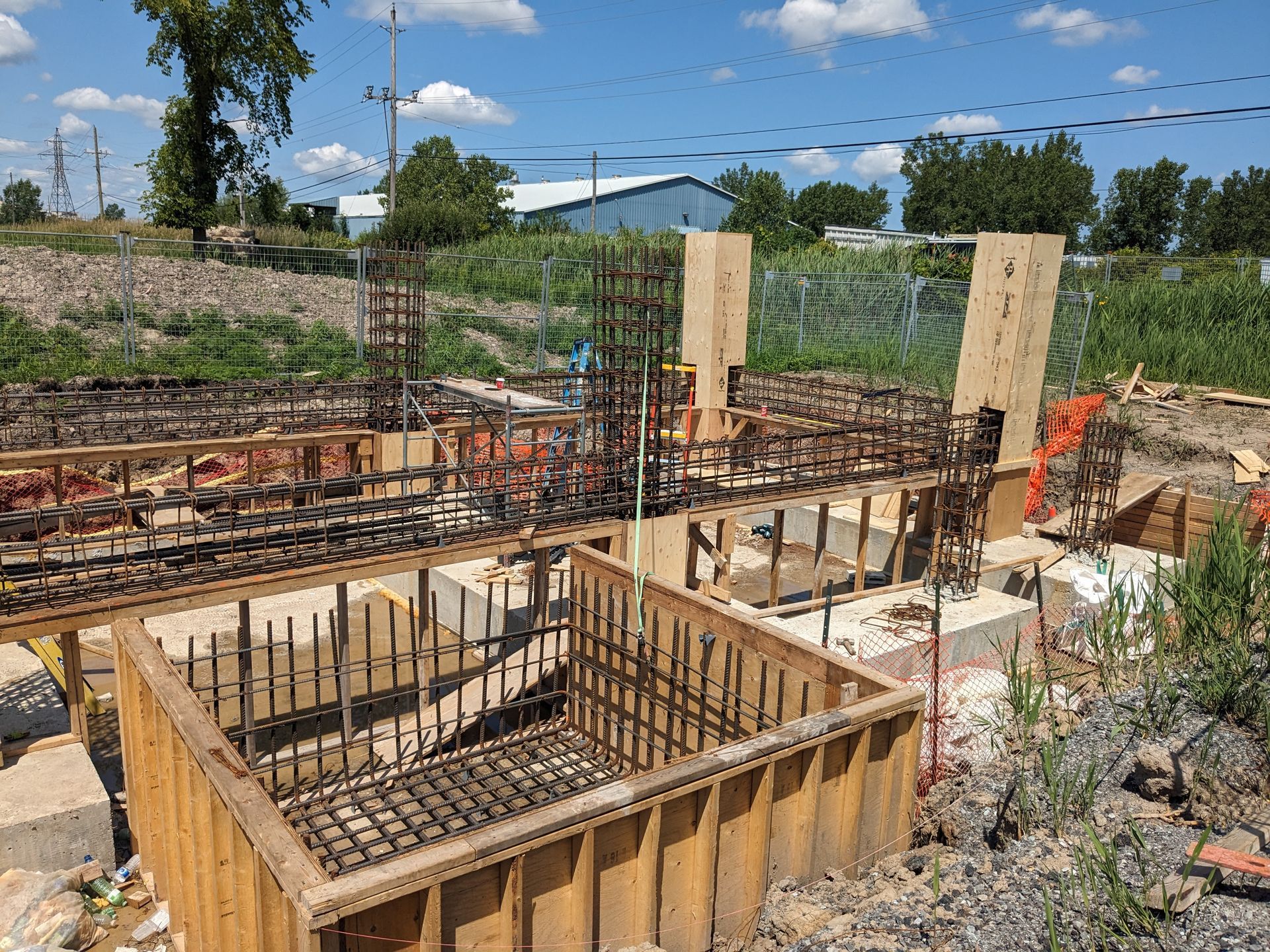 A construction site with a lot of wood and metal.