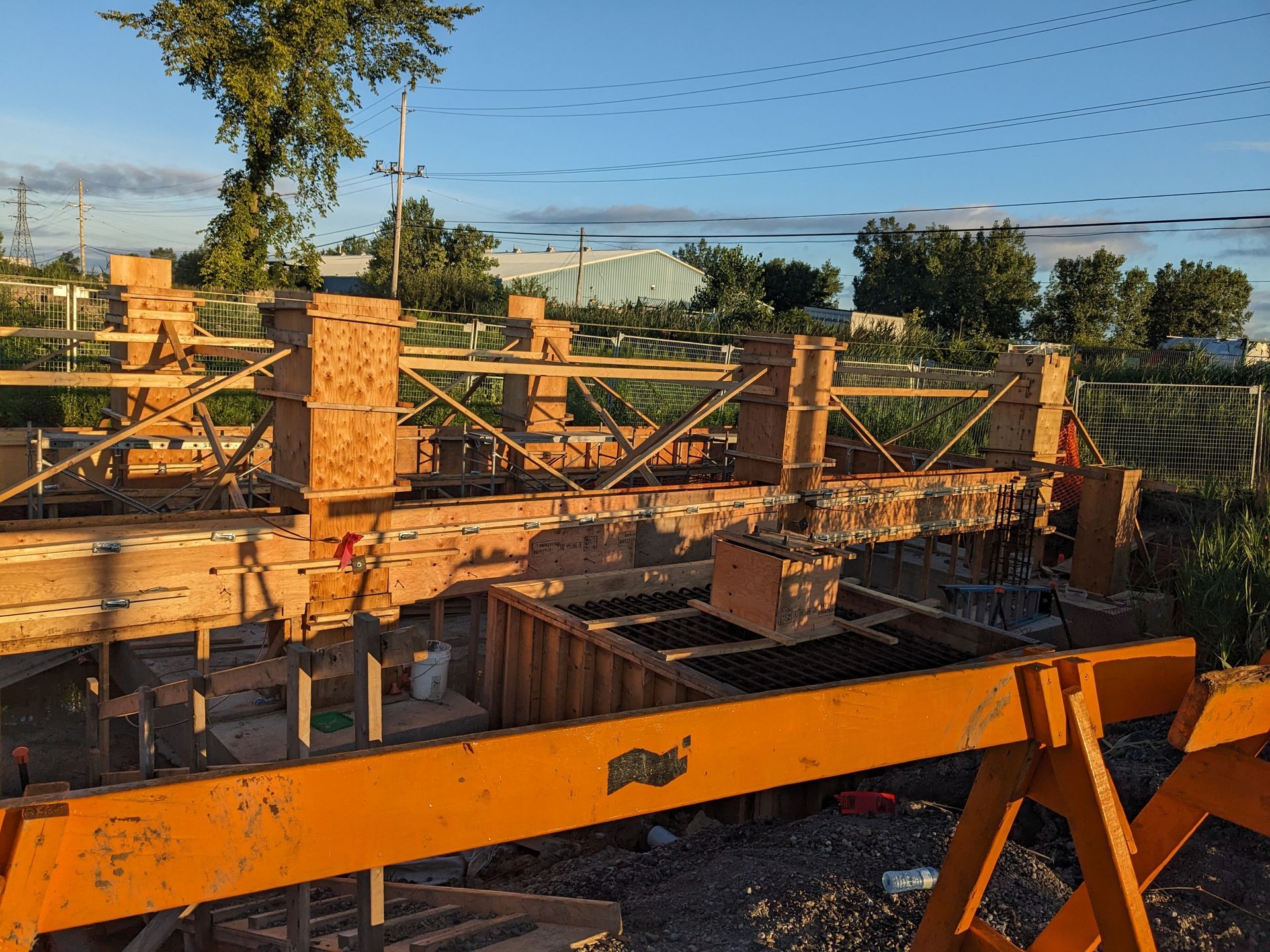 A construction site with a lot of wood and concrete.