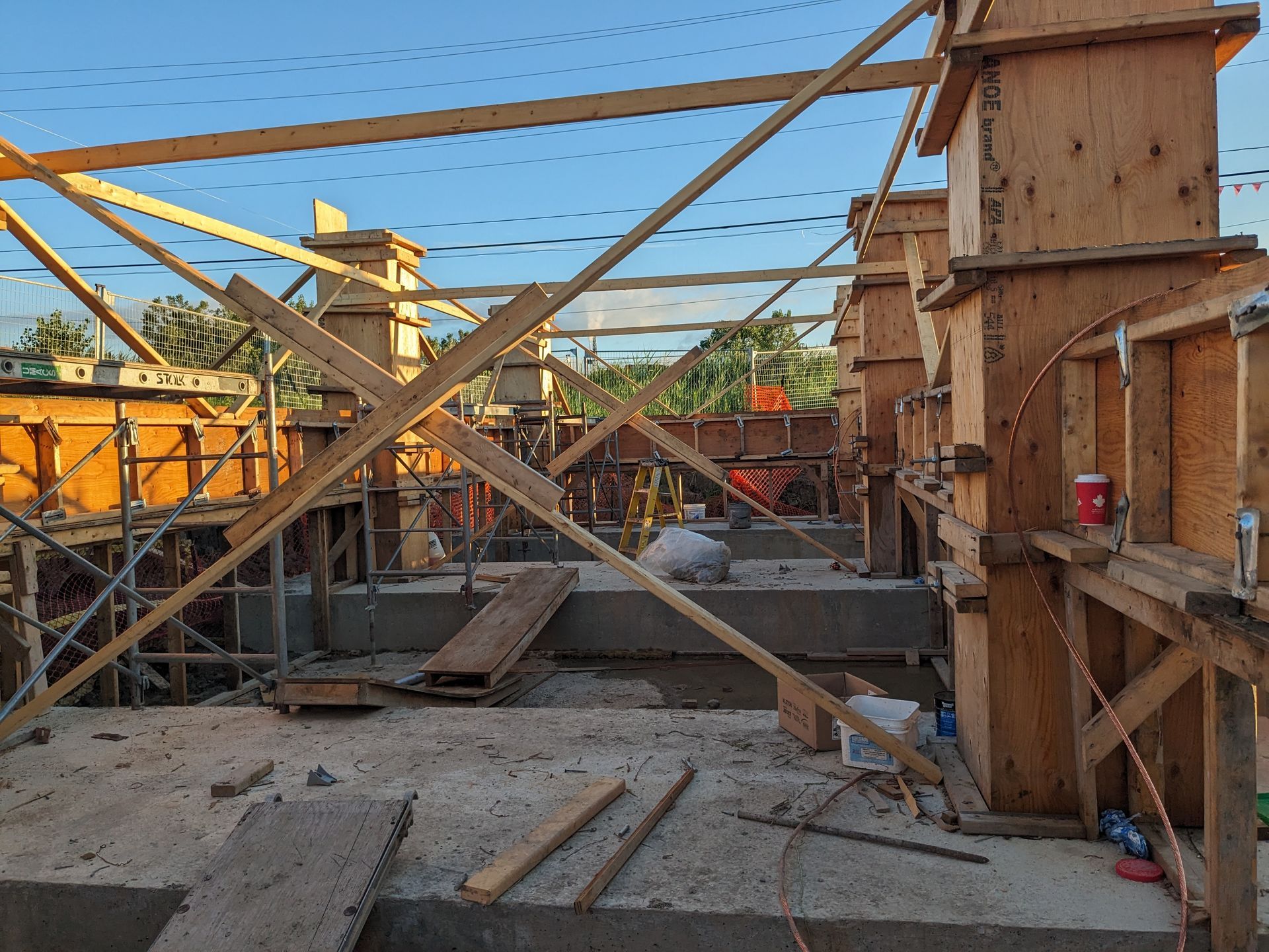 A construction site with a lot of wooden scaffolding