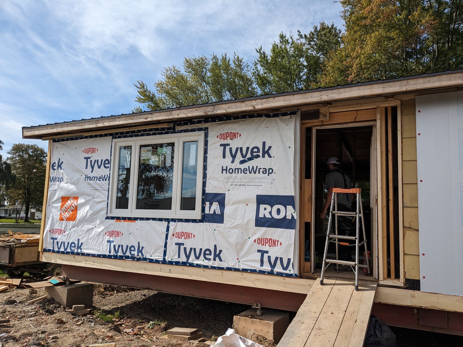 A house is being built with a lot of styrofoam on the side of it.