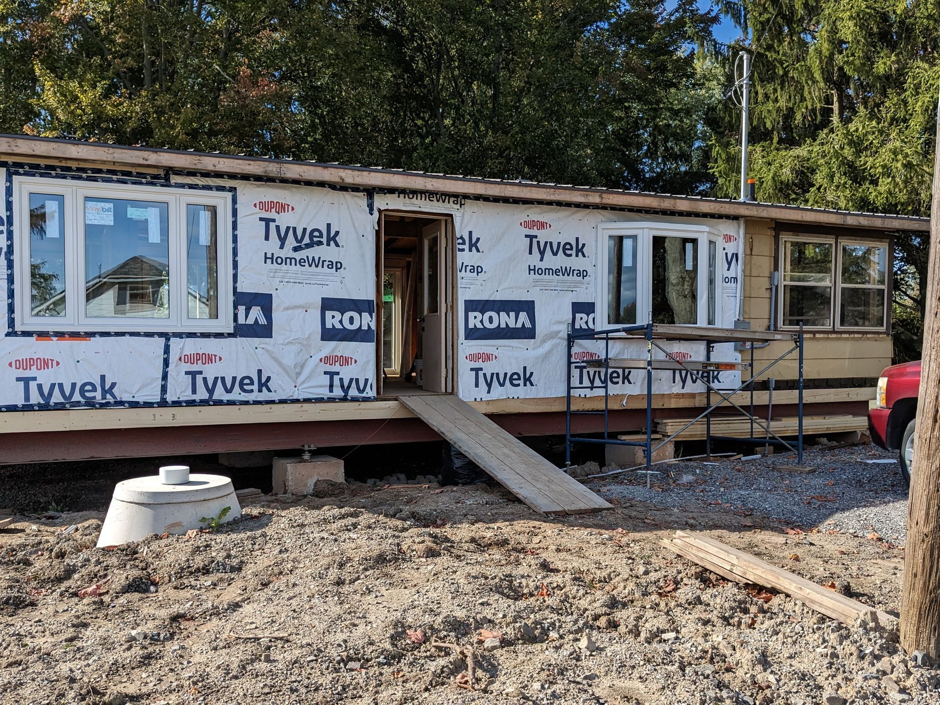 A house is being built with tyvek insulation on the side.