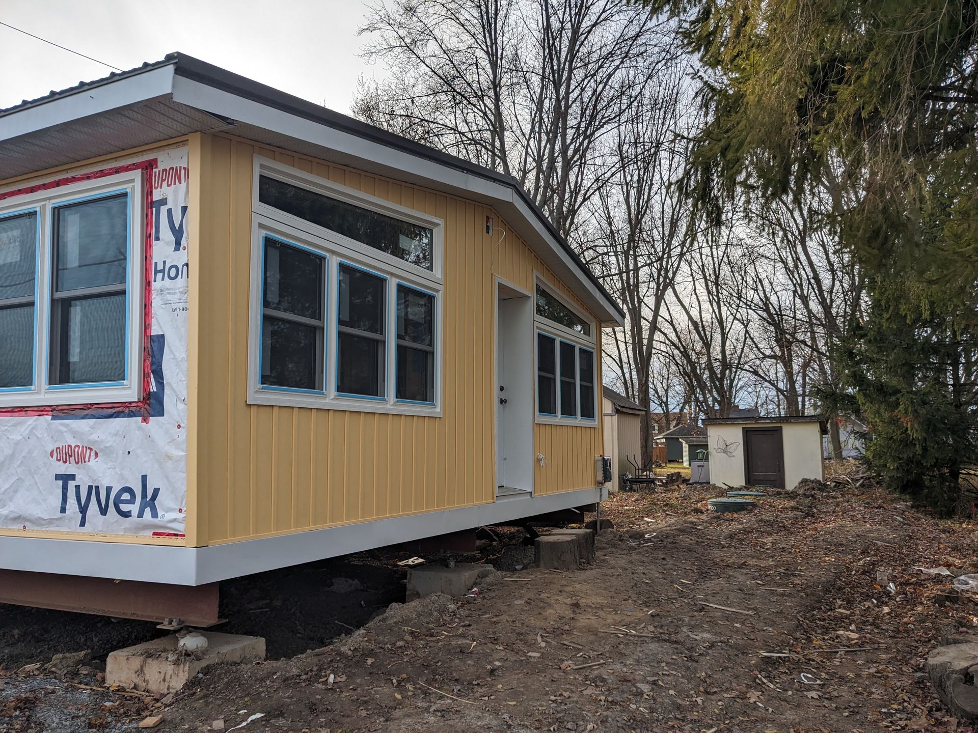 A small house is being built with tyvek insulation