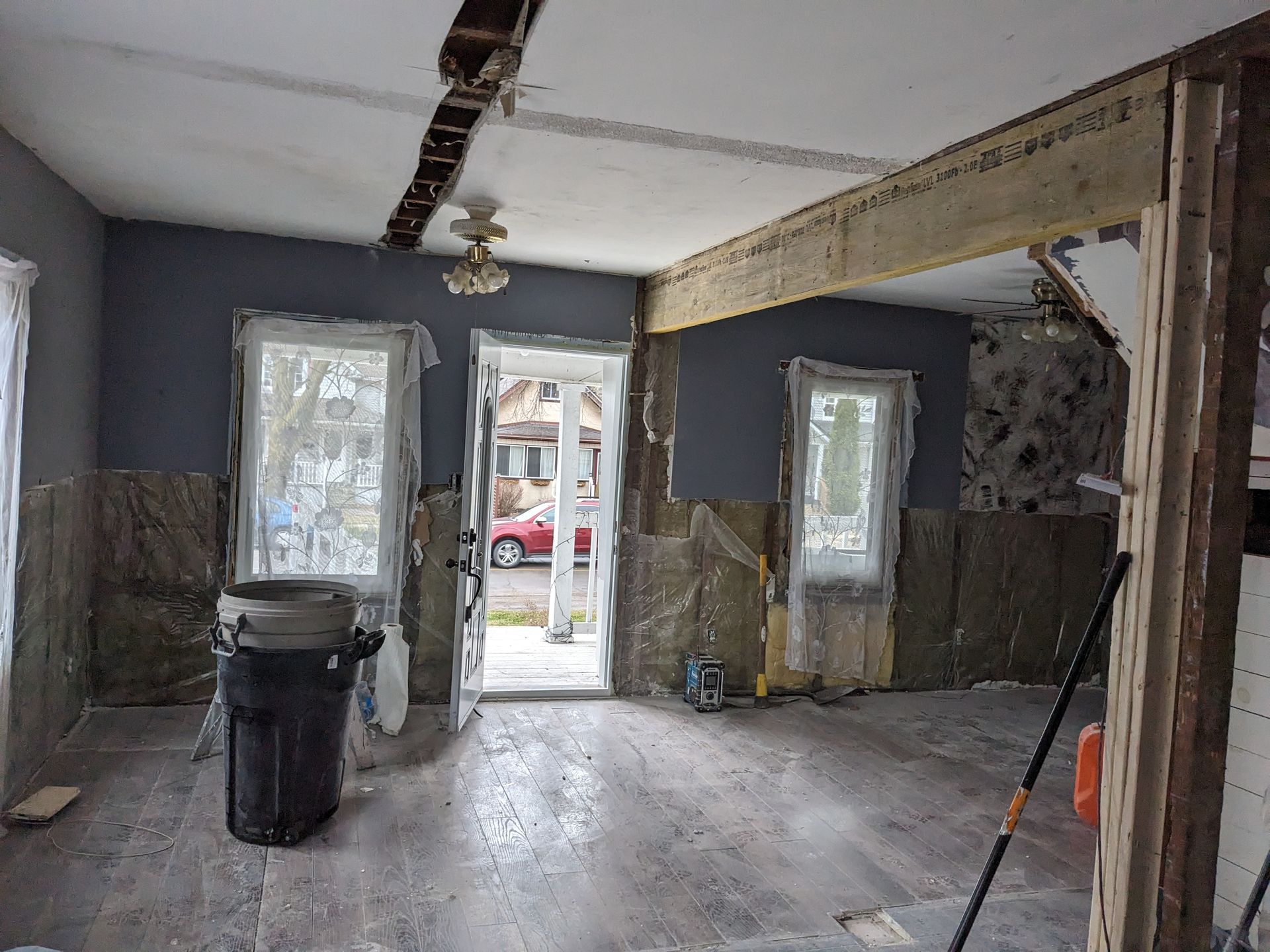 There is a trash can in the middle of the room.