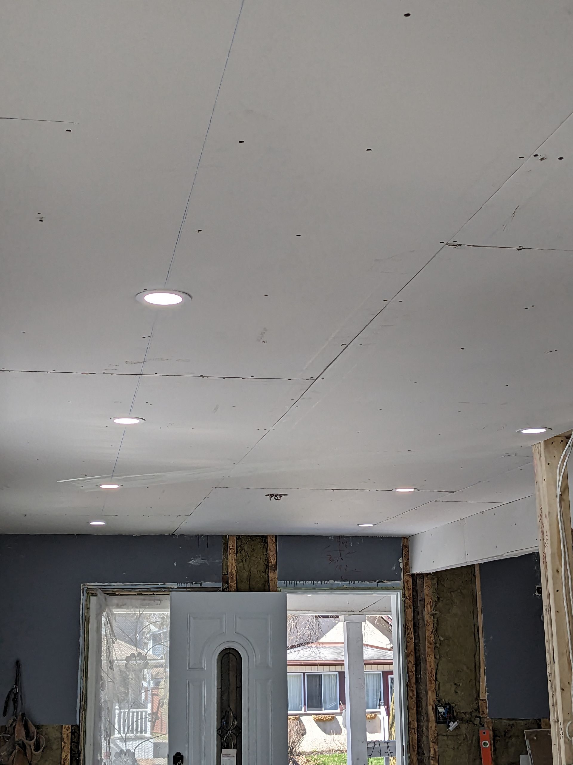A room with a ceiling that is being remodeled.