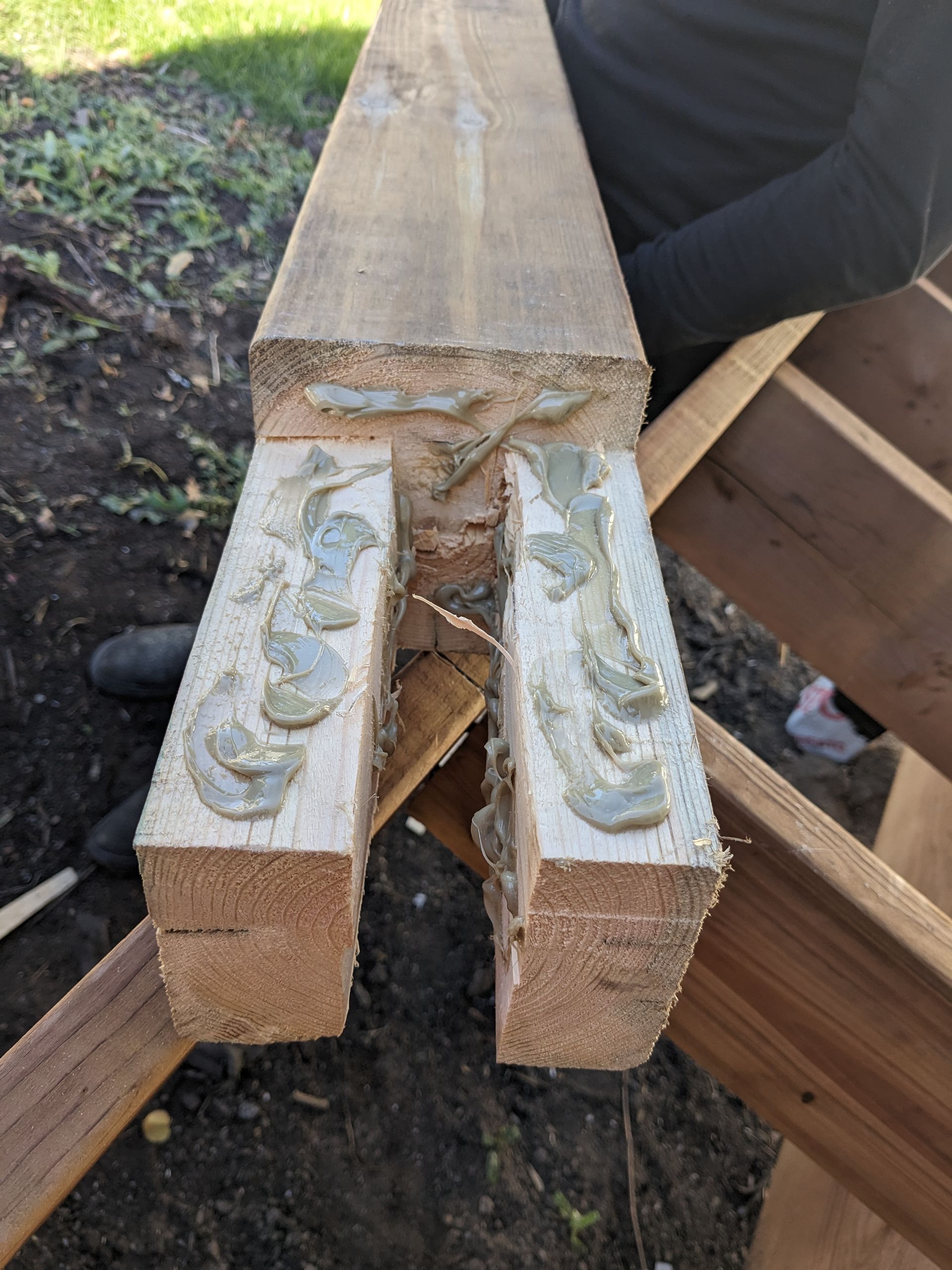 A close up of a piece of wood with glue on it.