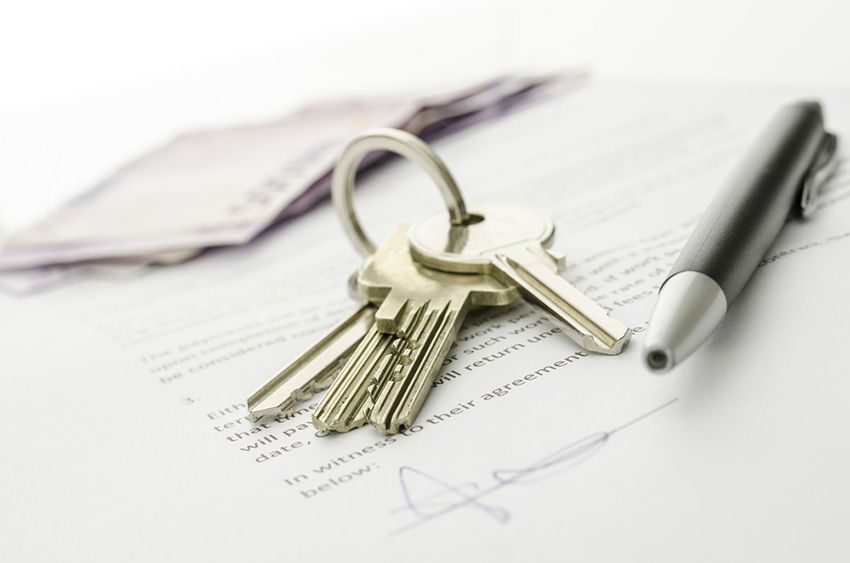 A Bunch of Keys and a Pen on Top of a Signed Document — Budd & Piper Solicitors & Conveyancers in Tweed Heads, NSW