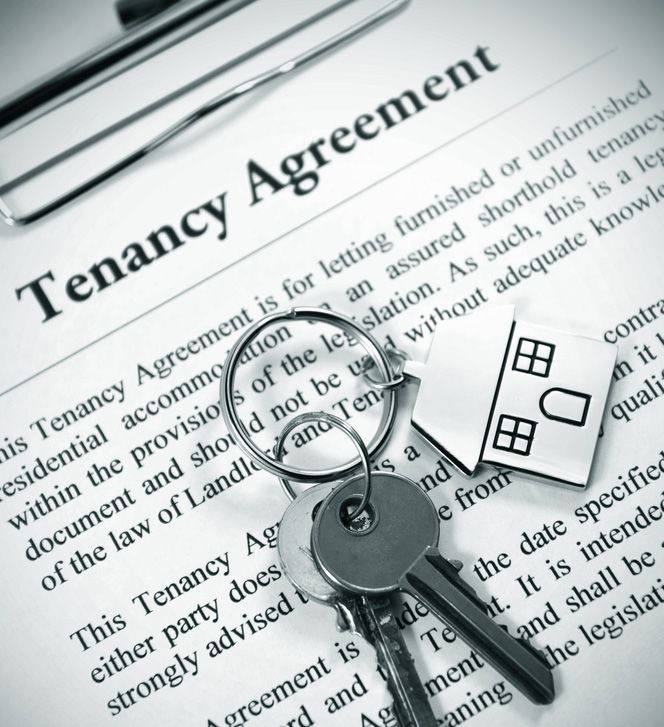 A Clipboard With the Word Tenancy Agreement on It — Budd & Piper Solicitors & Conveyancers in Tweed Heads, NSW