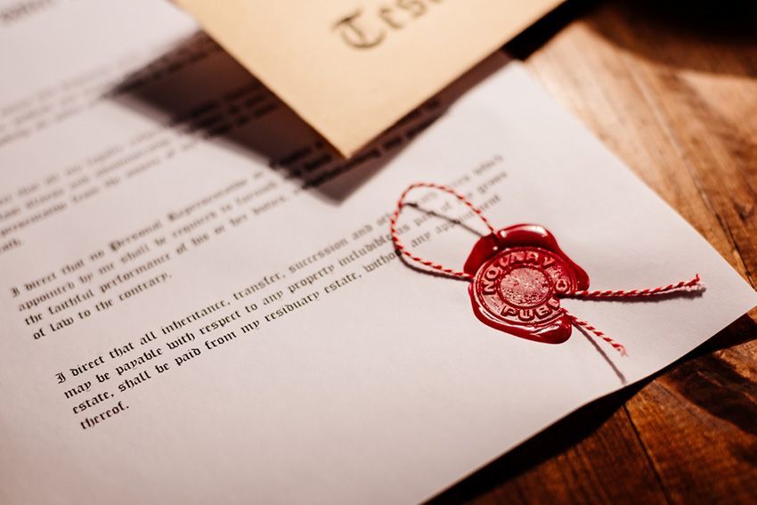 A Piece of Paper With a Red Wax Seal on It — Budd & Piper Solicitors & Conveyancers in Tweed Heads, NSW