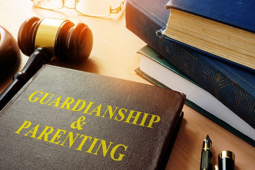 A Book Titled Guardianship and Parenting is on a Table — Budd & Piper Solicitors & Conveyancers in Tweed Heads, NSW