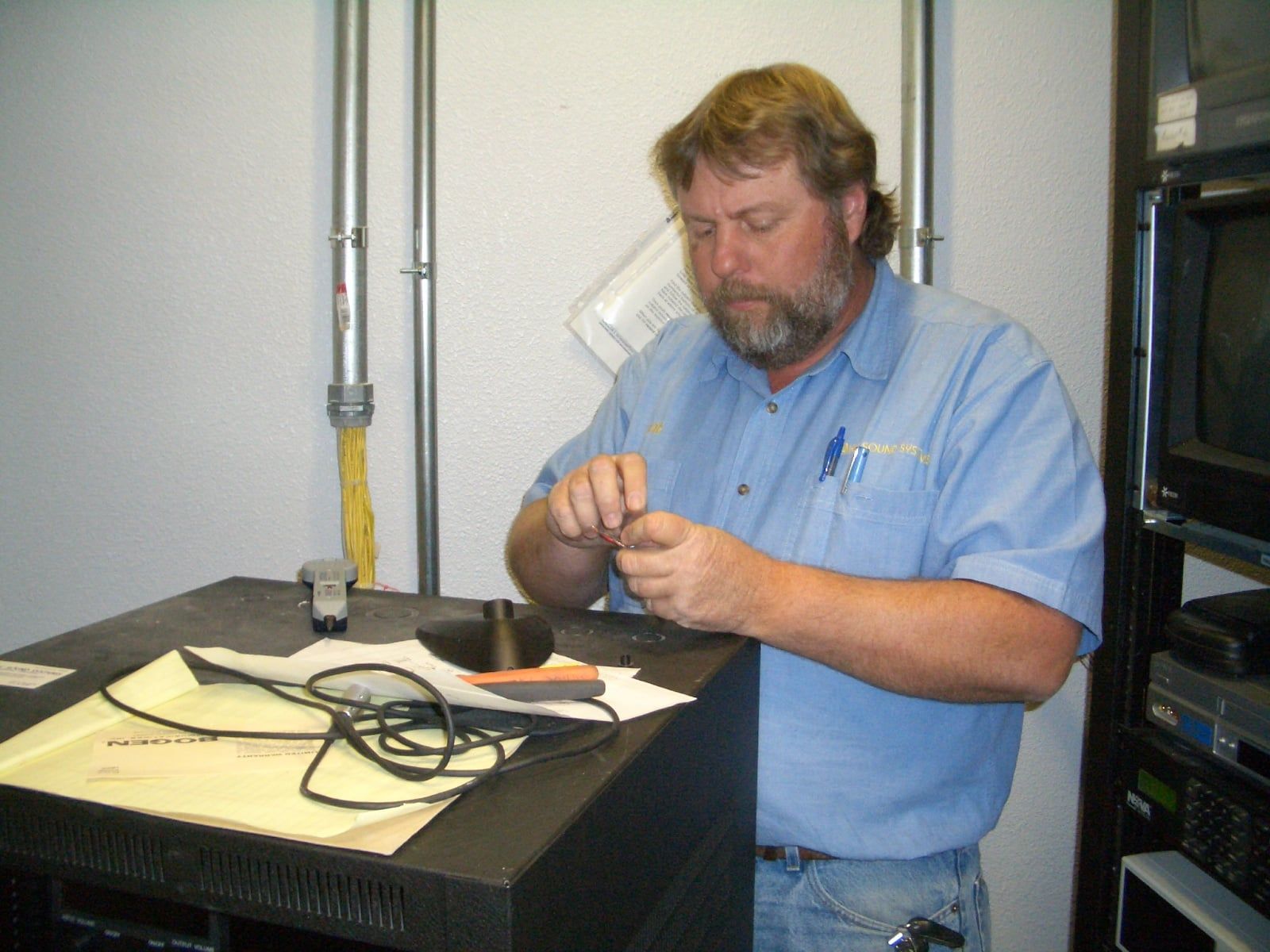 A man in a blue shirt.