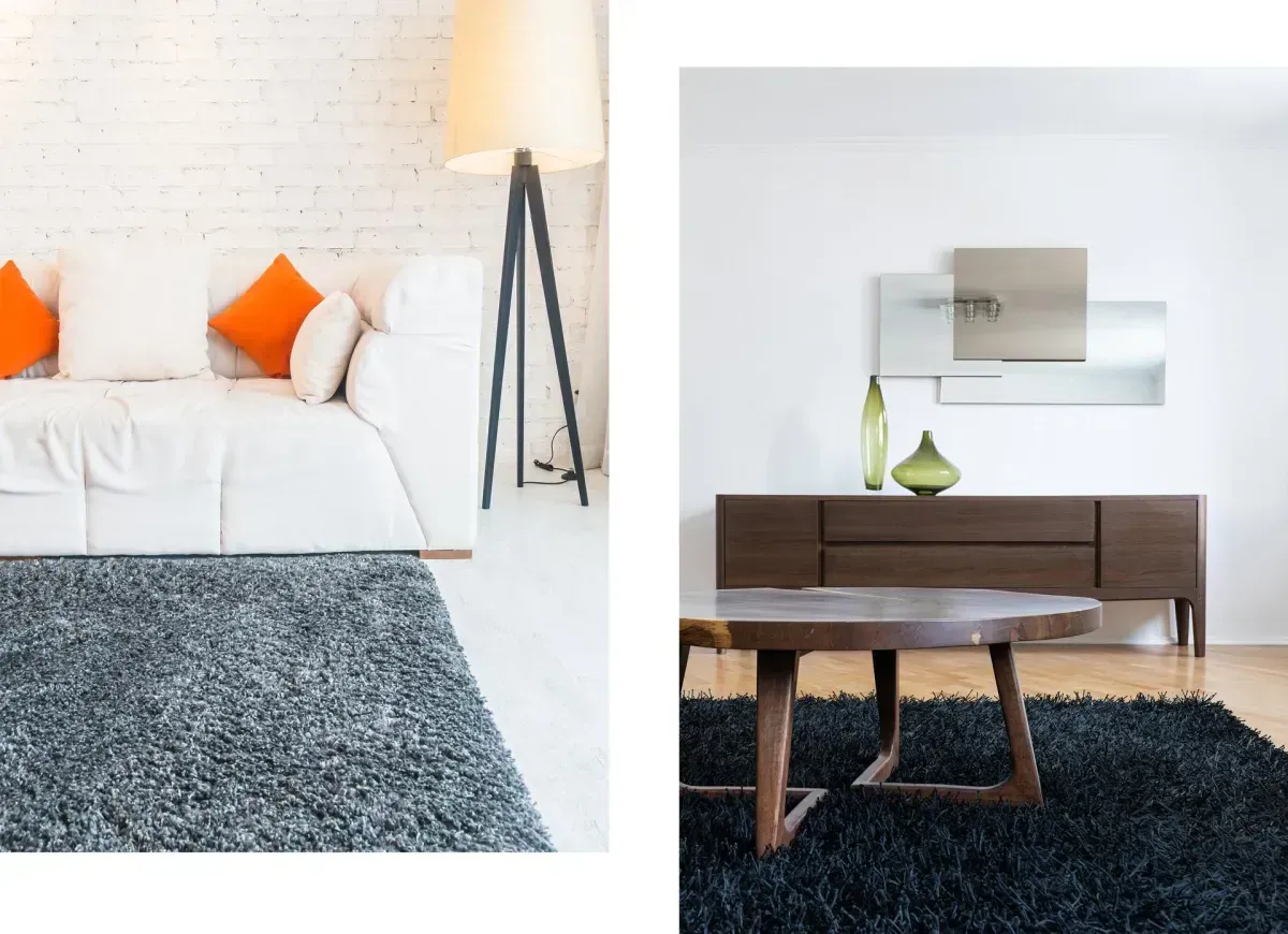Two rooms with minimalist decor: white couch and orange pillows, dark shag rug, wooden table, and sideboard.