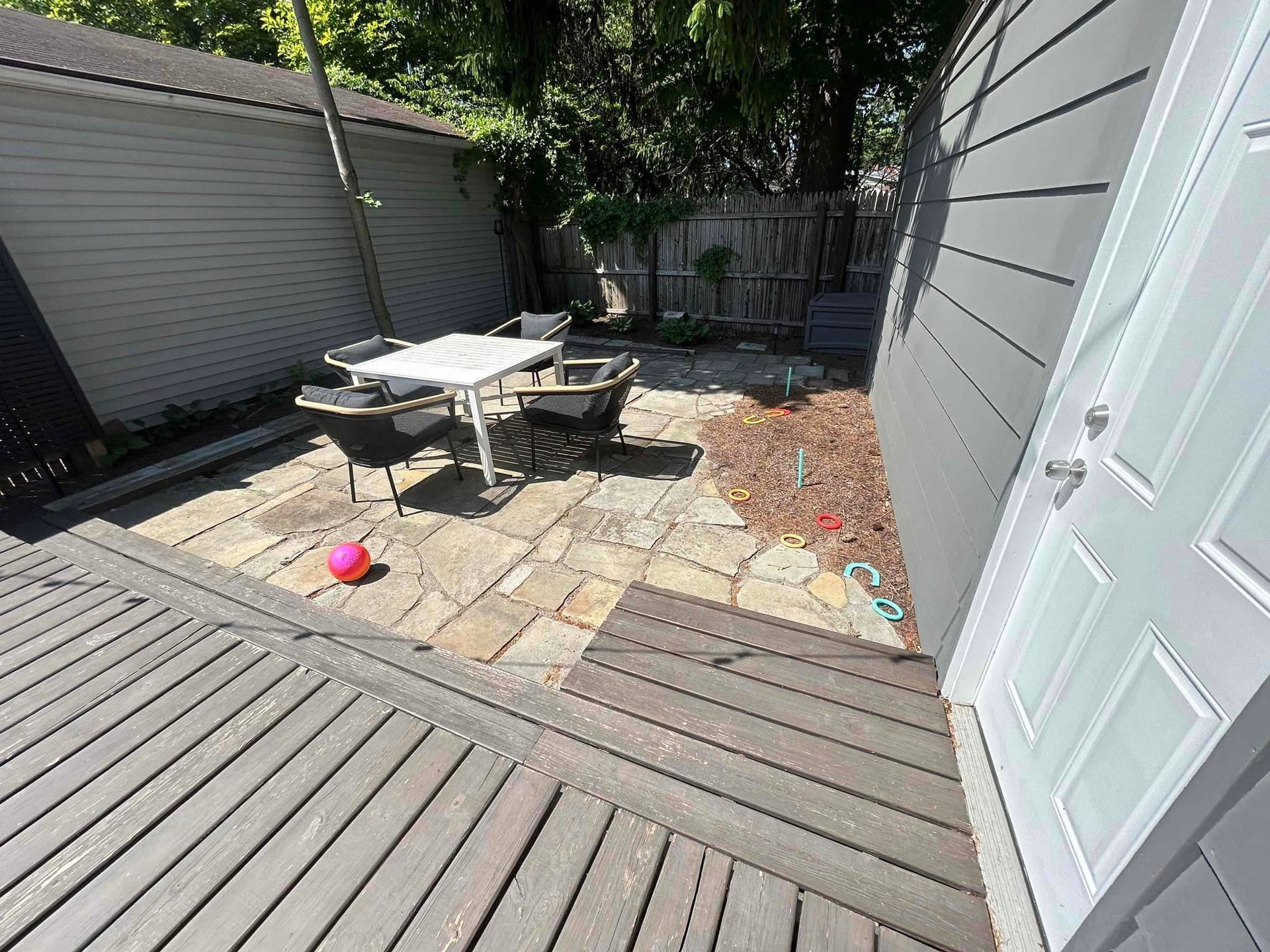 Wooden Deck with a Table and Chairs — Northeast OH — Believeland Landscaping and Snow Removal