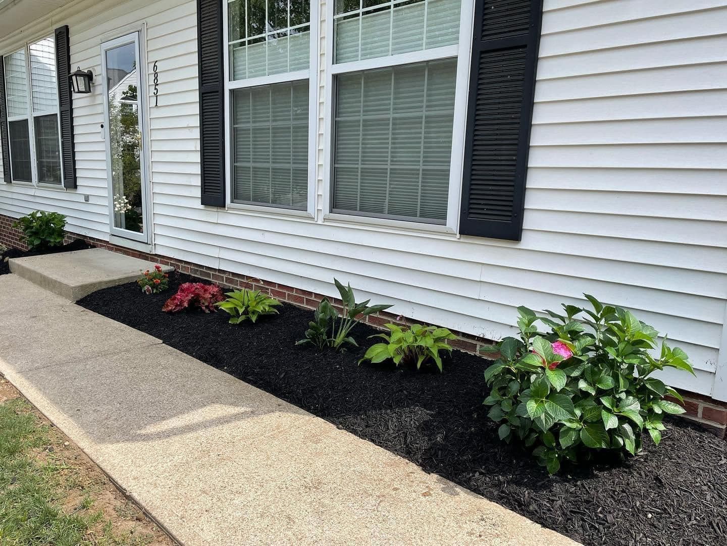 White House with Black Shutters — Northeast OH — Believeland Landscaping and Snow Removal