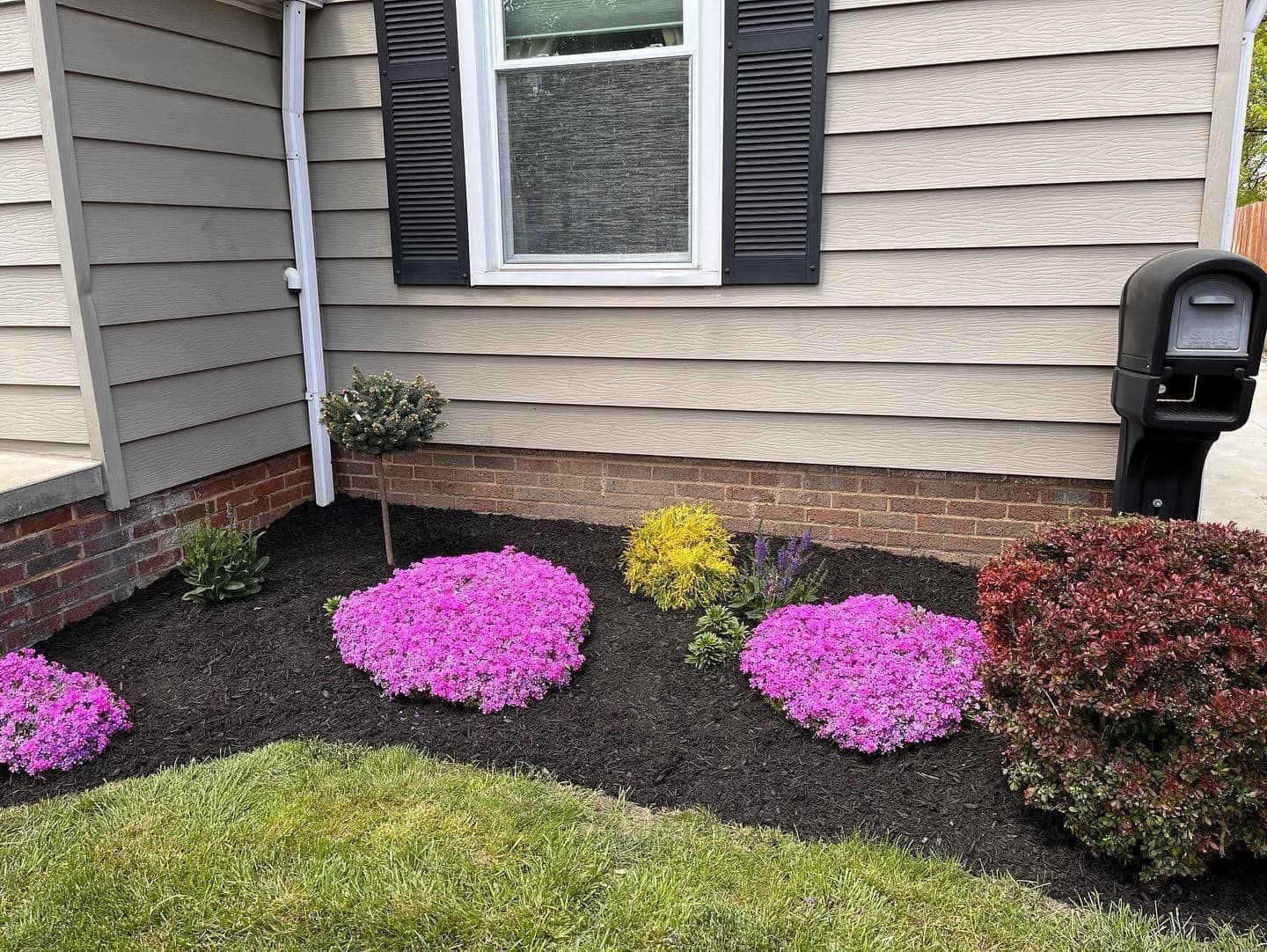 House with Purple Flowers — Northeast OH — Believeland Landscaping and Snow Removal