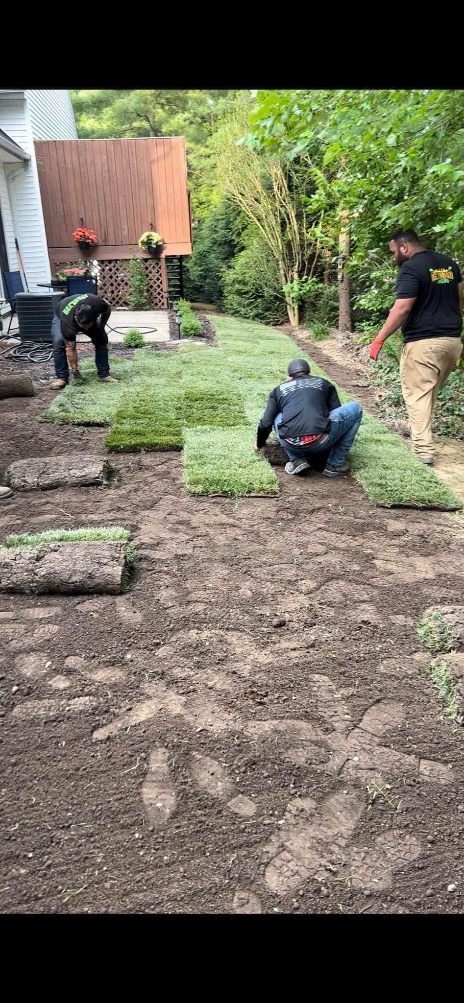 Group of Men Are Working on a Lawn — Northeast OH — Believeland Landscaping and Snow Removal