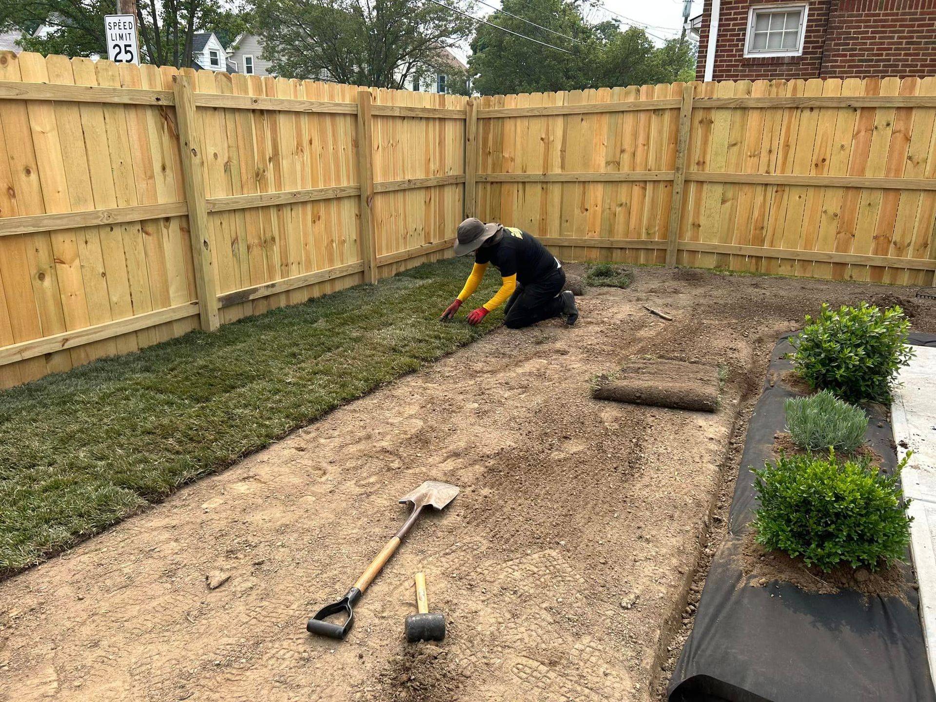 Man with a Shovel — Northeast OH — Believeland Landscaping and Snow Removal