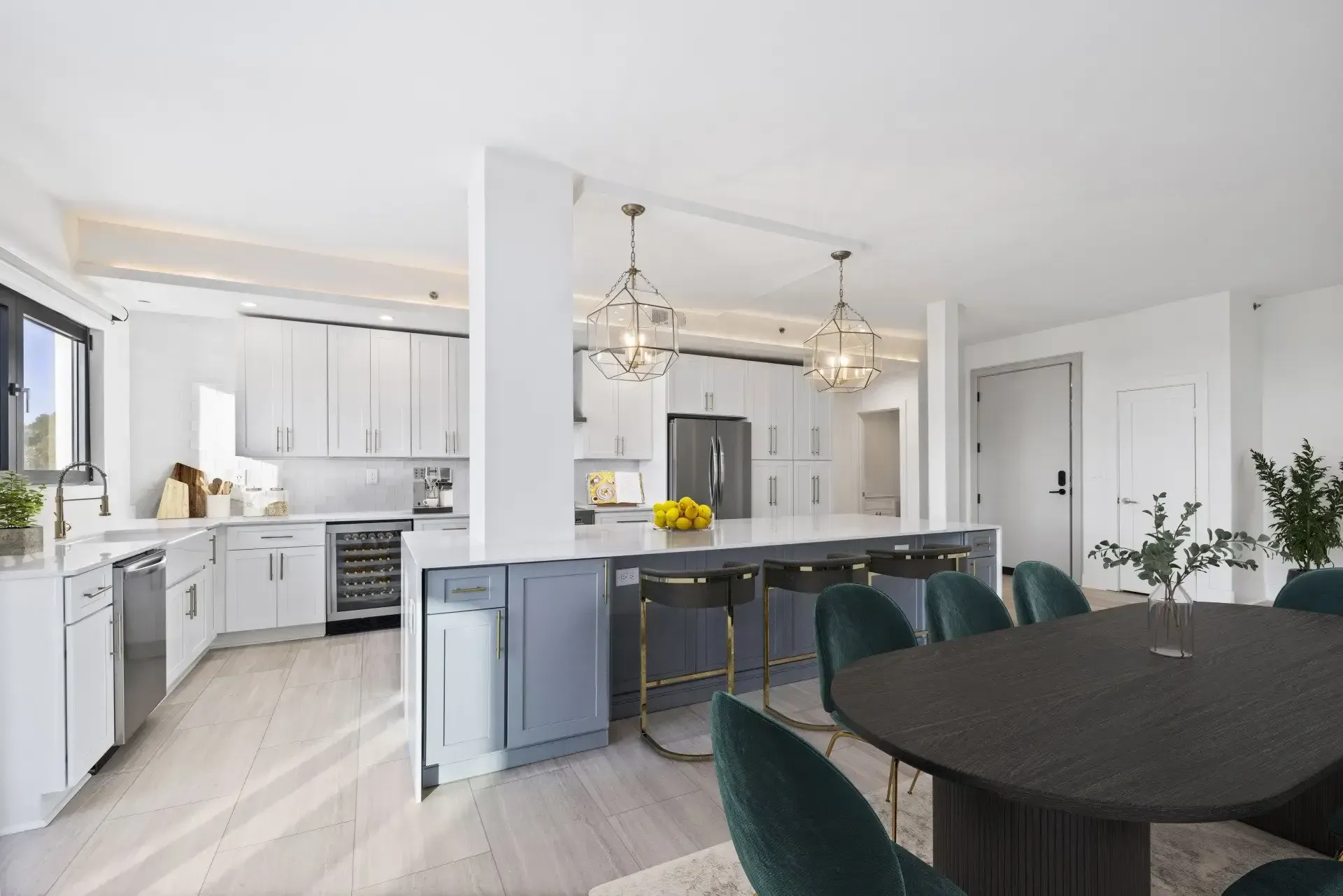 A kitchen and dining room in a house with a table and chairs.