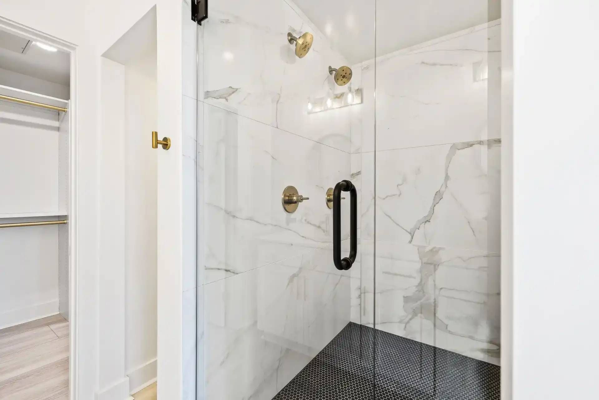 Shower with Golden Hardware at Ilion Apartments in Marietta, GA.