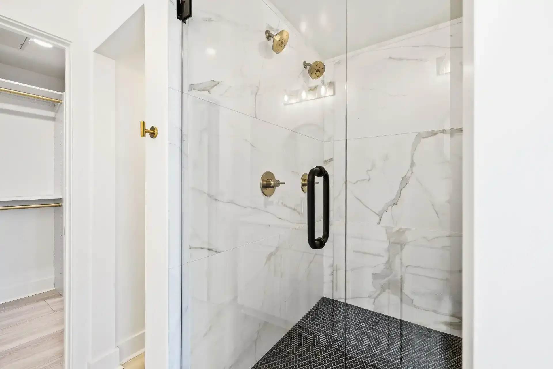 Shower with Golden Hardware at Ilion Apartments in Marietta, GA.