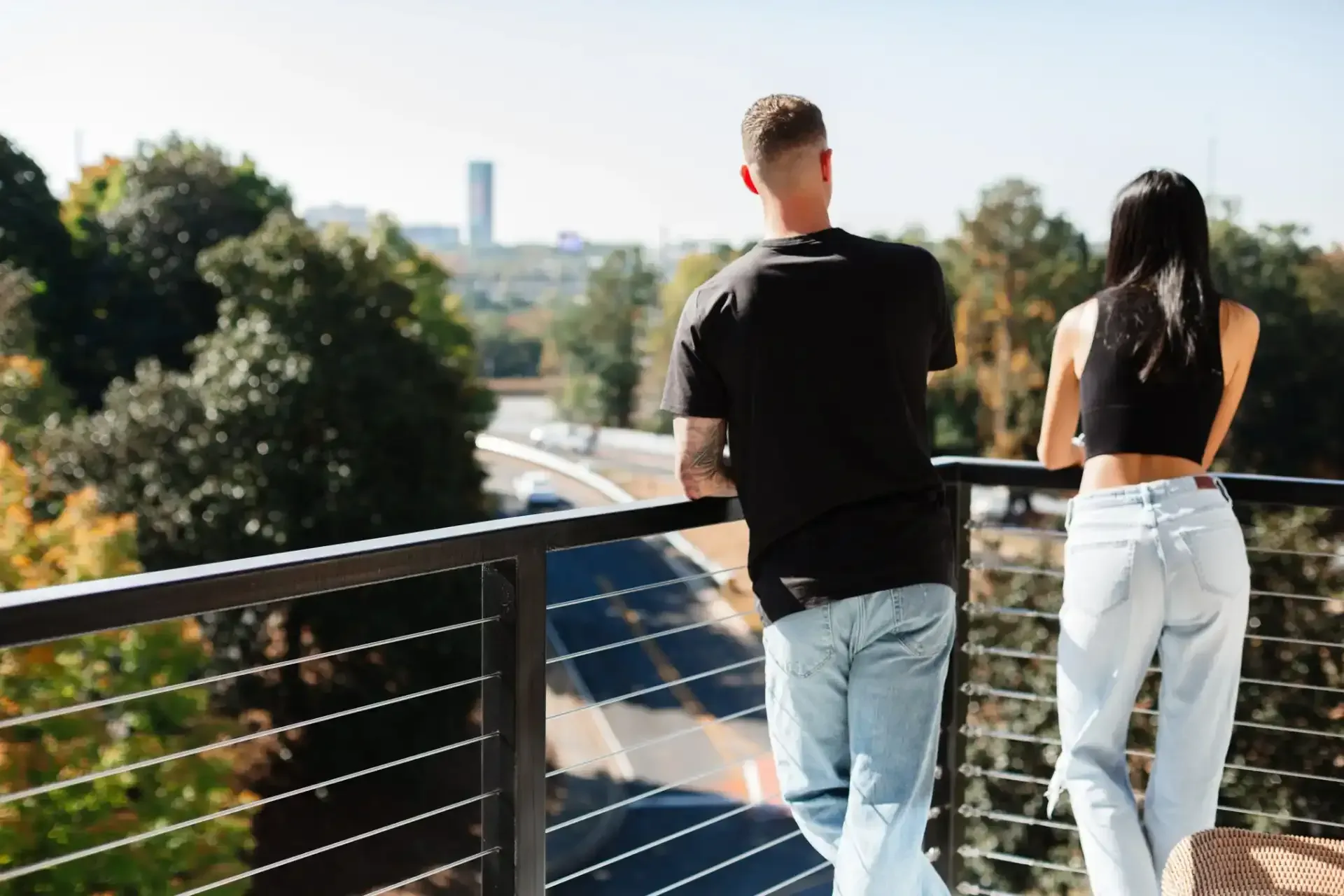 Residents on Balcony at Ilion Apartments.