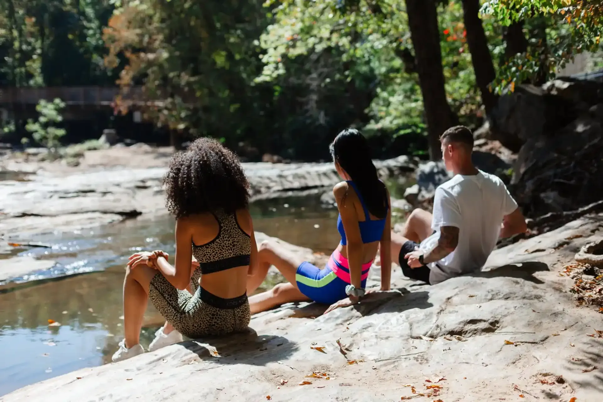 Residents Sitting by Water at Ilion Apartments.