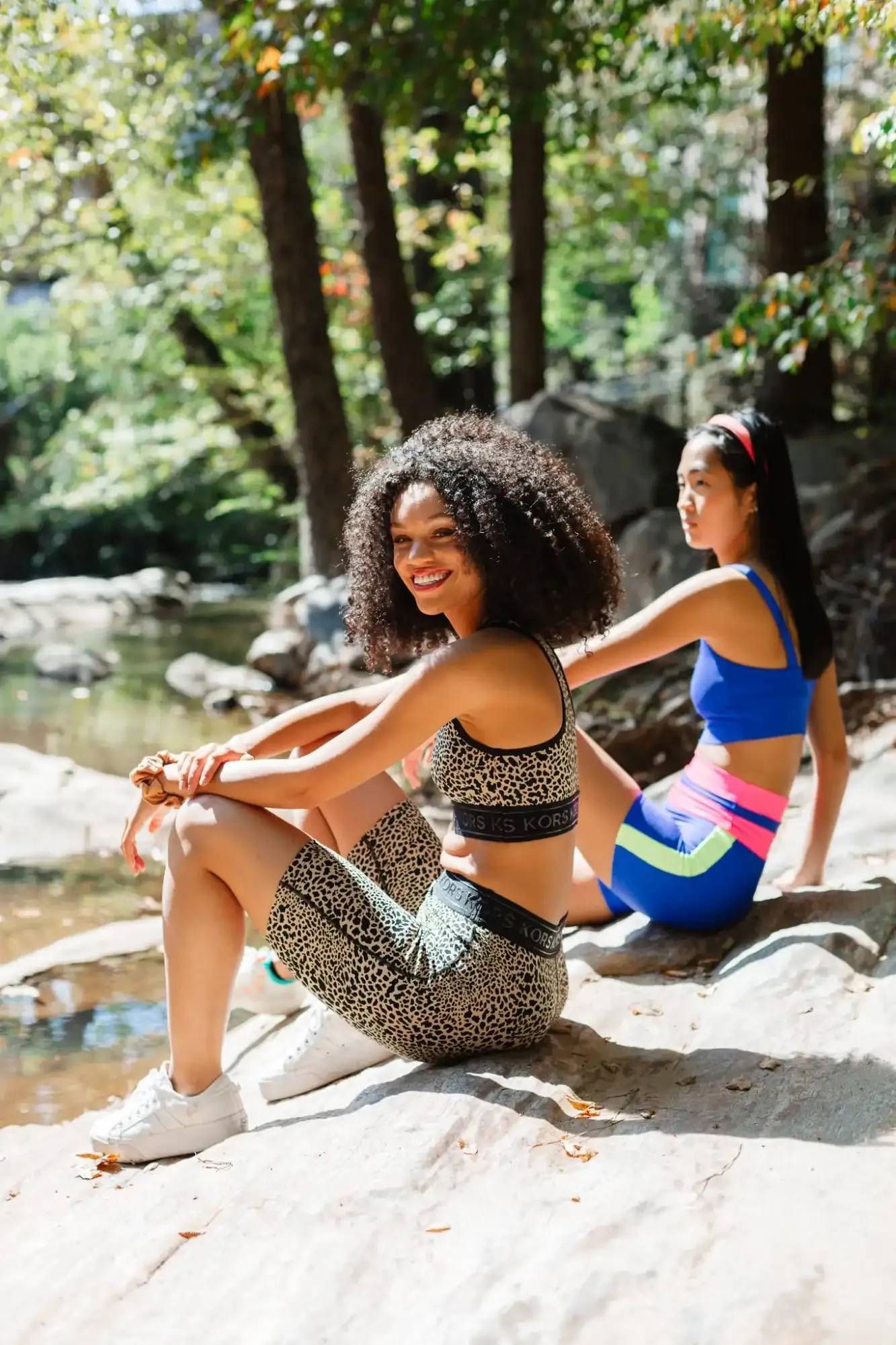 Residents Sitting by Water at Ilion Apartments.
