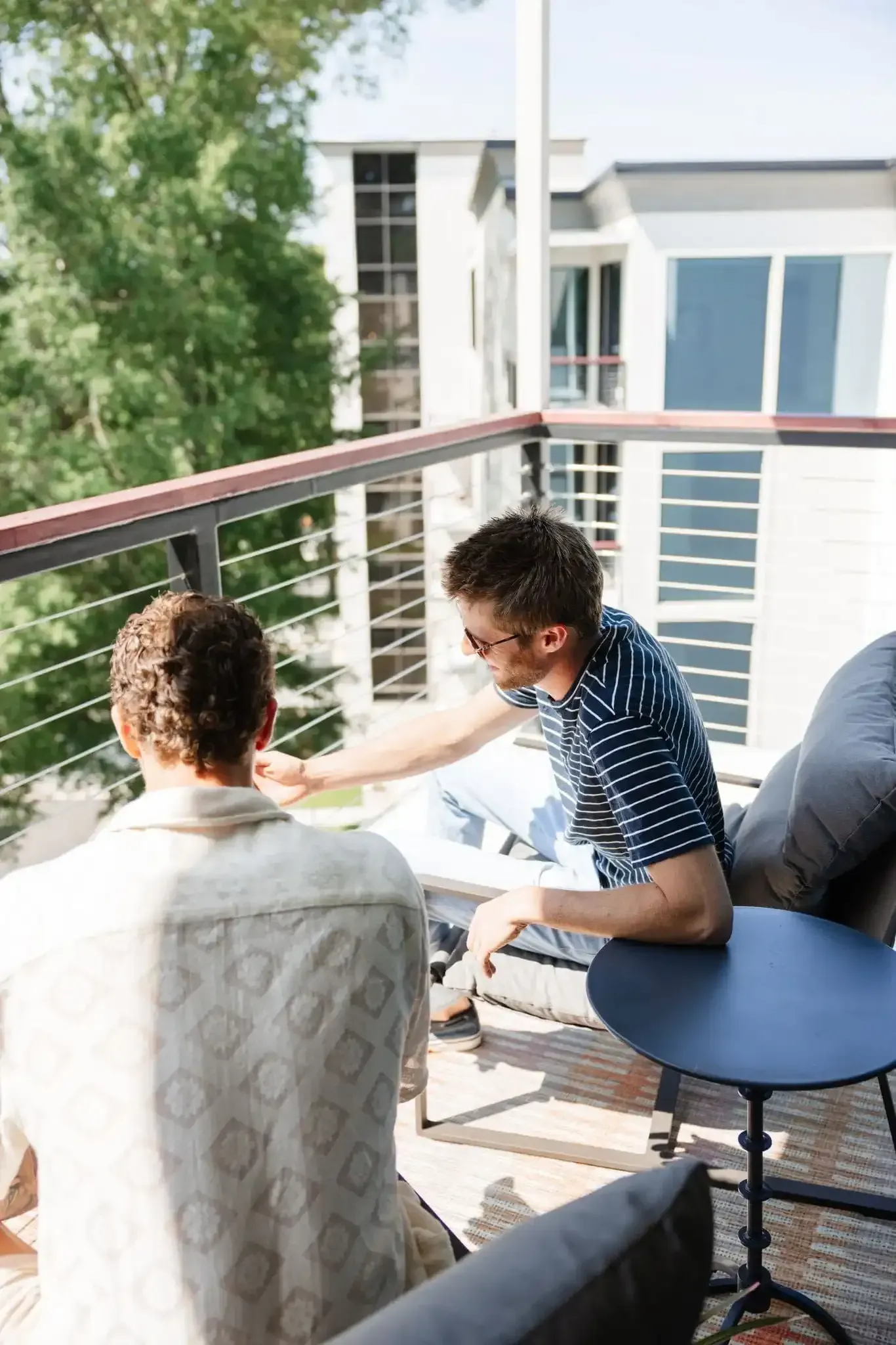 Residents on Balcony at Ilion Apartments.