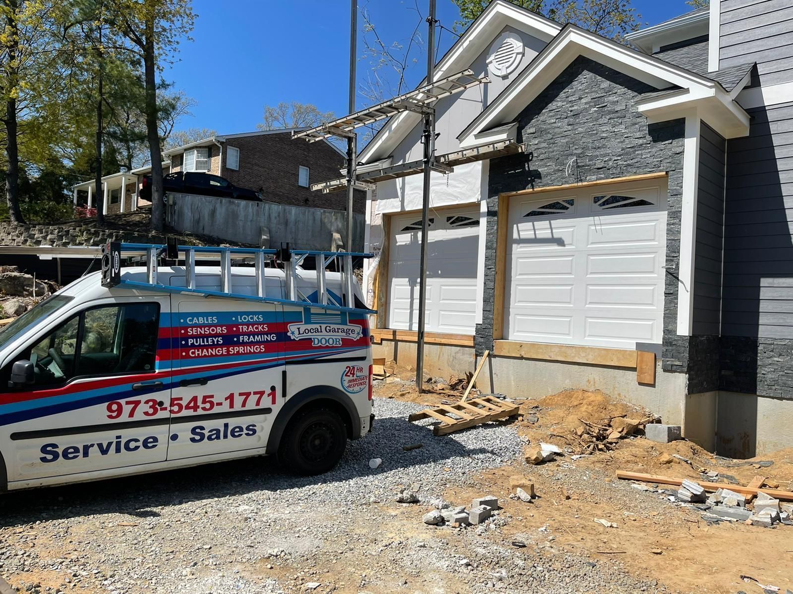 A Service Van Is Parked in Front of A House – New Jersey - Local Garage Door