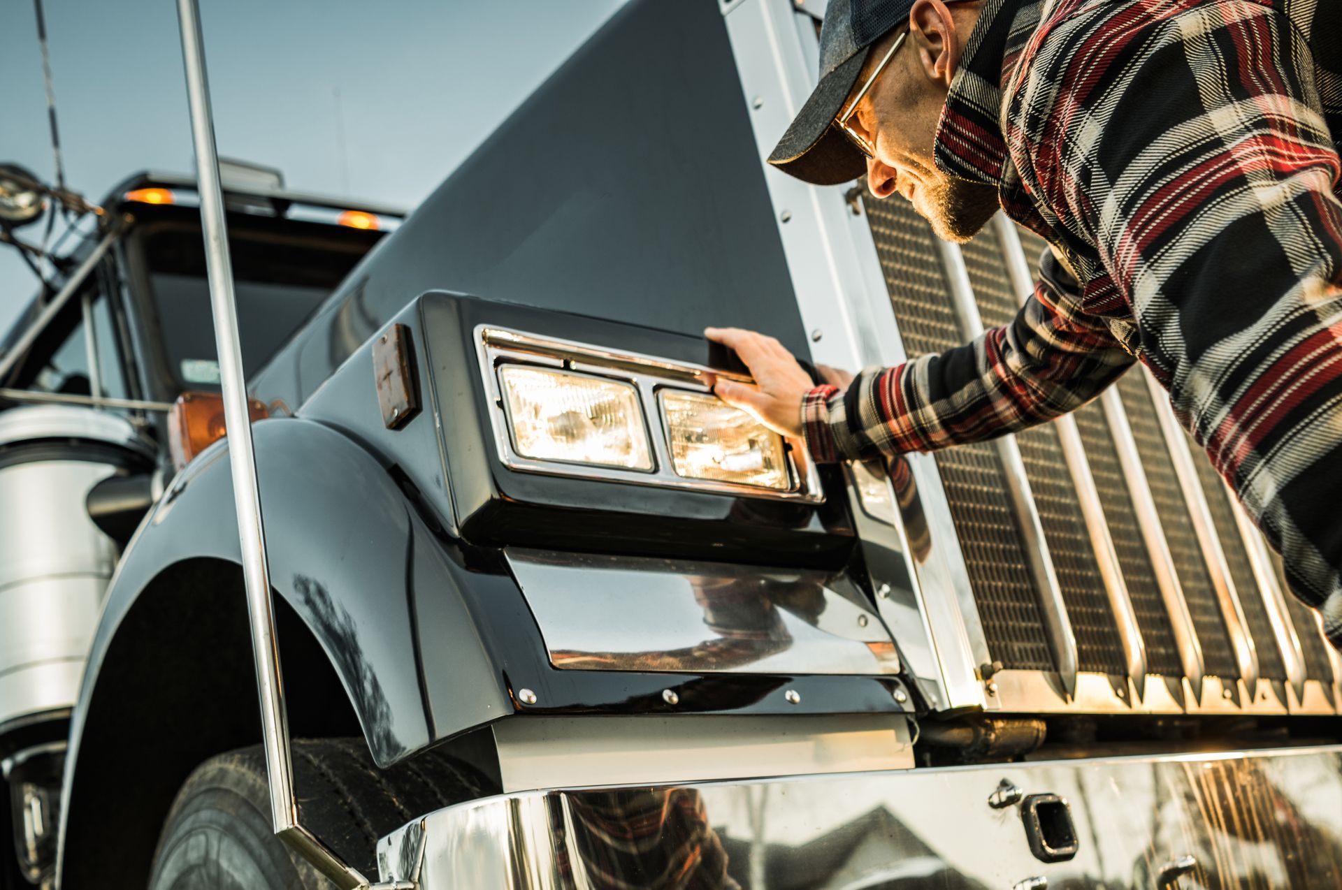 man checking his truck lighting