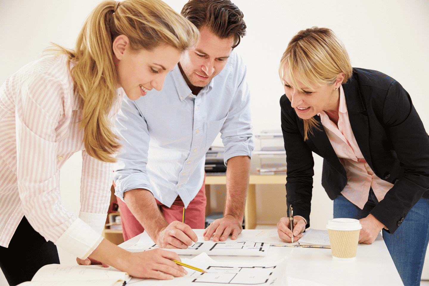 three people in a planning meeting