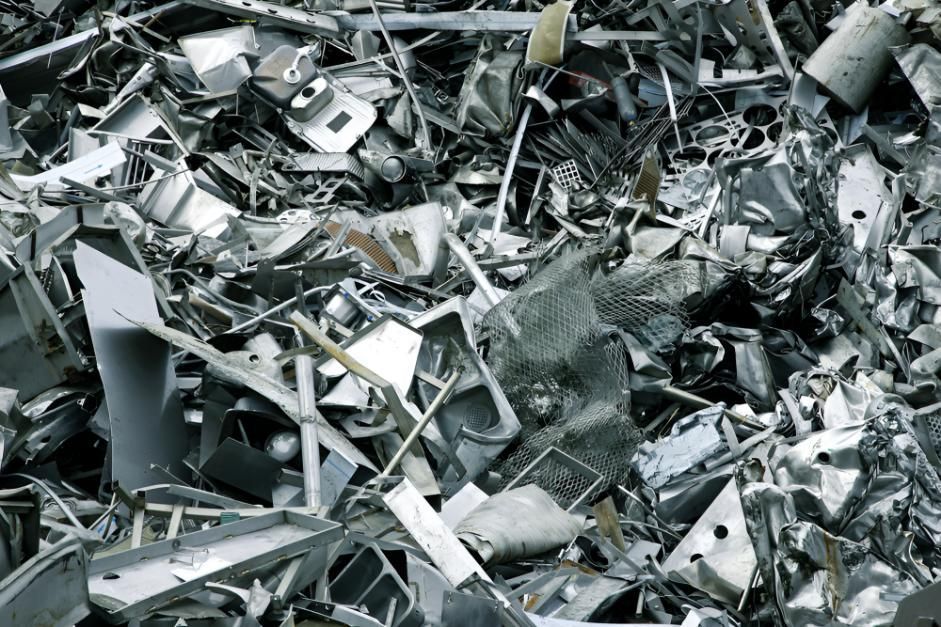 Pile of Scrap Metal is Sitting on Top of Each Other — Maryborough Recycling in Tin Can Bay, QLD