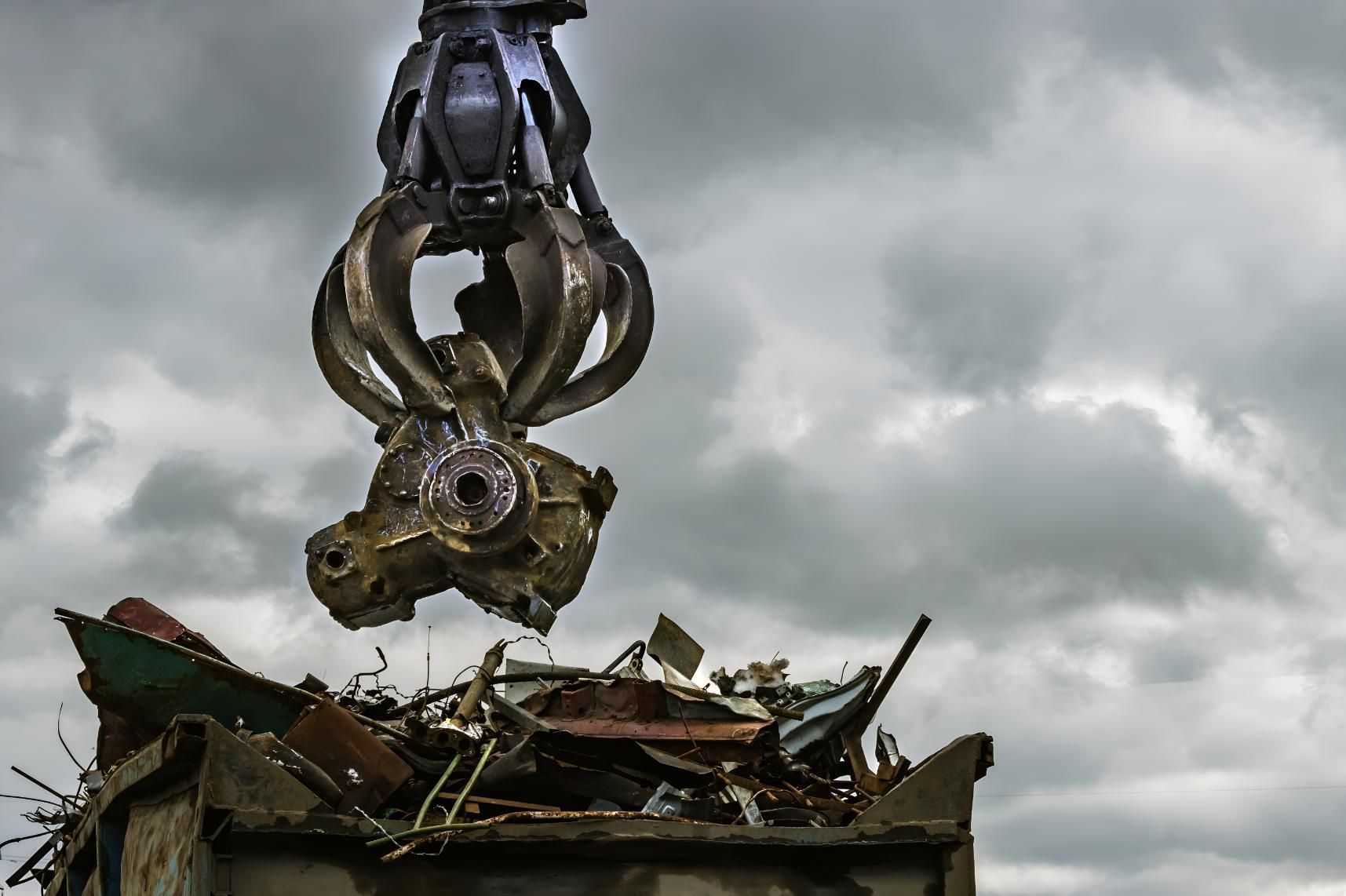 Crane is Lifting a Pile of Scrap Metal — Maryborough Recycling in Tiaro, QLD