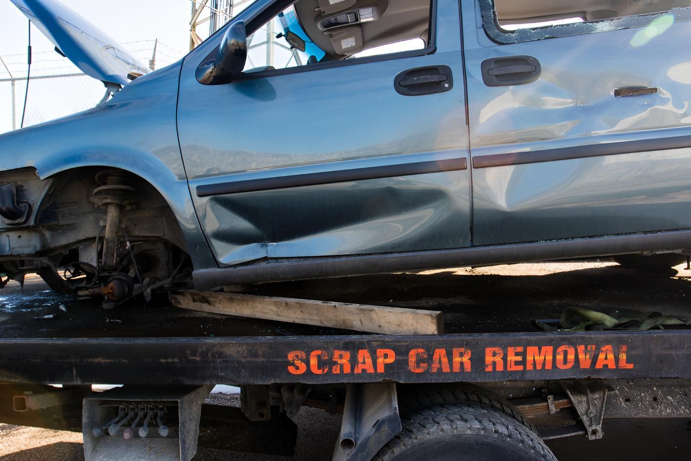 Blue Car is Sitting on Top of a Scrap — Maryborough Recycling in Maryborough, QLD