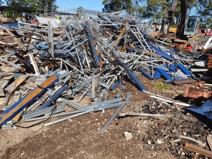 Pile of Scrap Metal is Sitting on the Ground — Maryborough Recycling in Maryborough, QLD