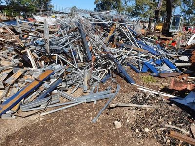 Pile of Scrap Metal is Sitting on the Ground — Maryborough Recycling in Maryborough, QLD