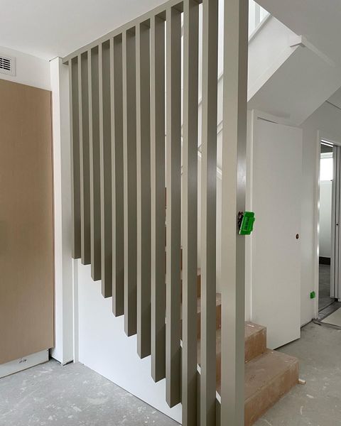 ladder in the middle of a room being renovated