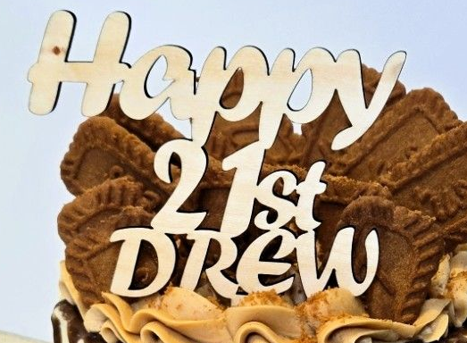 Wooden cake topper reading 