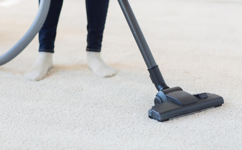 Cleaning Carpet with Vacuum Cleaner