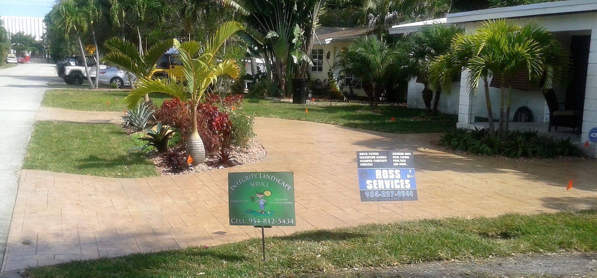 A sign in front of a house that says for sale