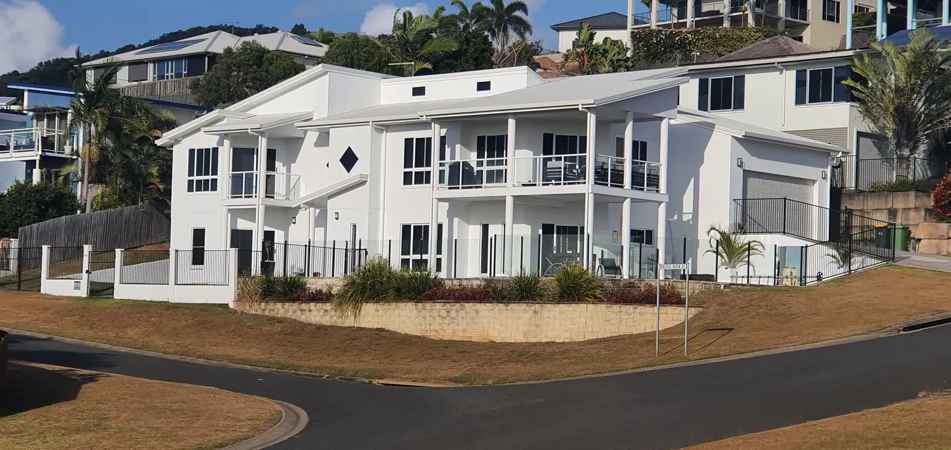 White Multi-story Building With Balconies — Keppel Coatings in Pacific Heights, QLD