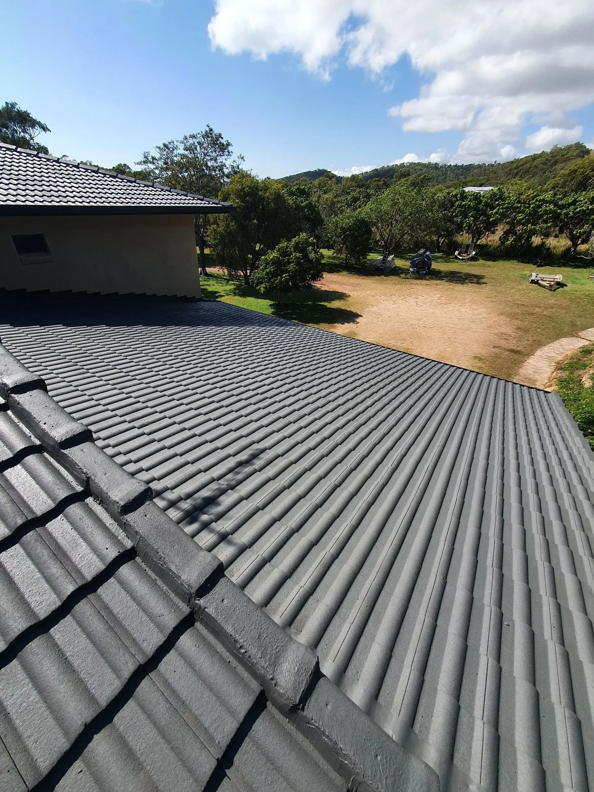 Close-up View of a Grey Corrugated Roof — Keppel Coatings in Pacific Heights, QLD