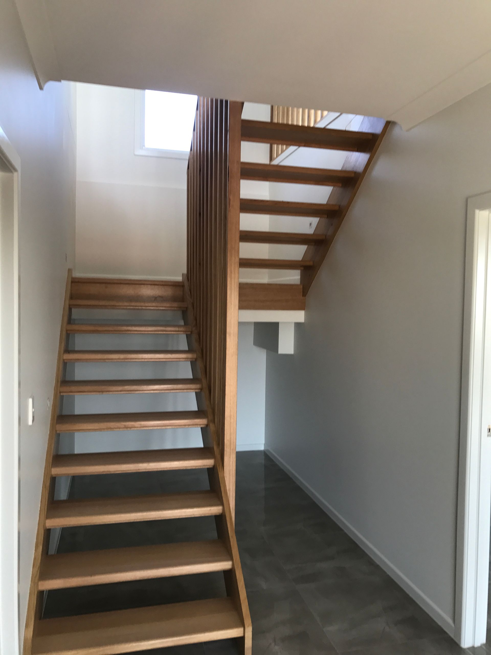 Wooden Staircase With Wooden Banister — Keppel Coatings in Pacific Heights, QLD