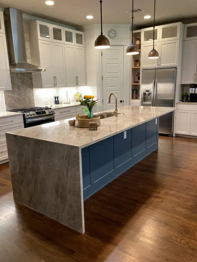There is a large island in the middle of the kitchen.