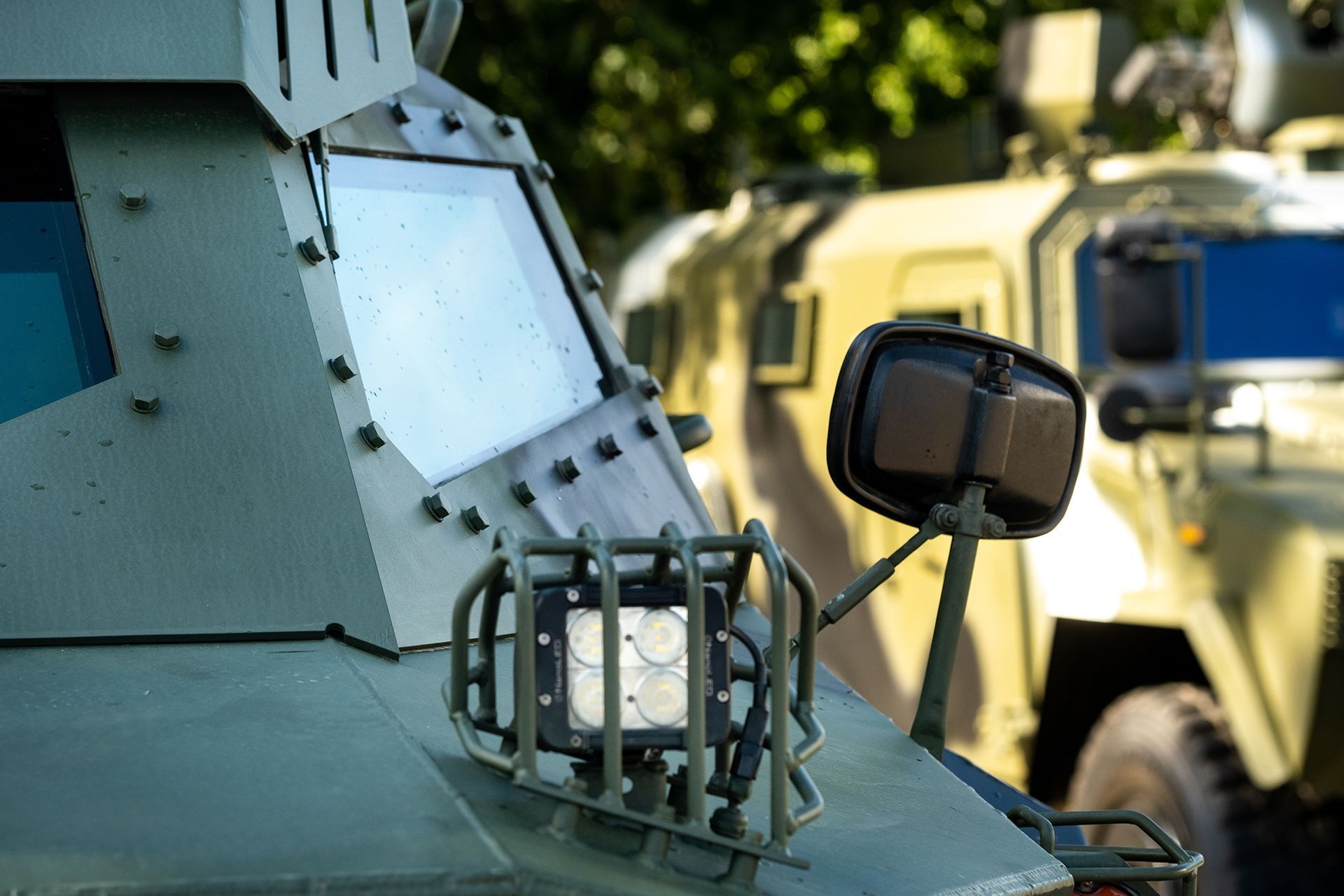 a close up of a mirror on a military vehicle