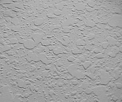 Textured light gray wall surface.