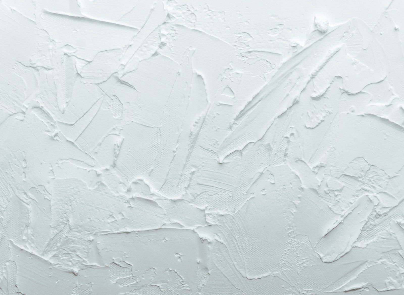 Textured white wall with thick, uneven trowel marks.