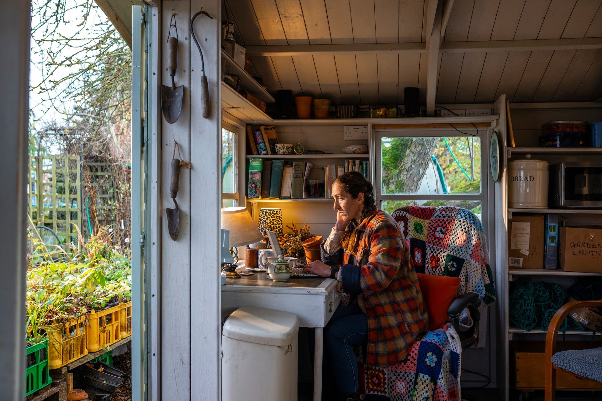 A woman working in a storage shed.