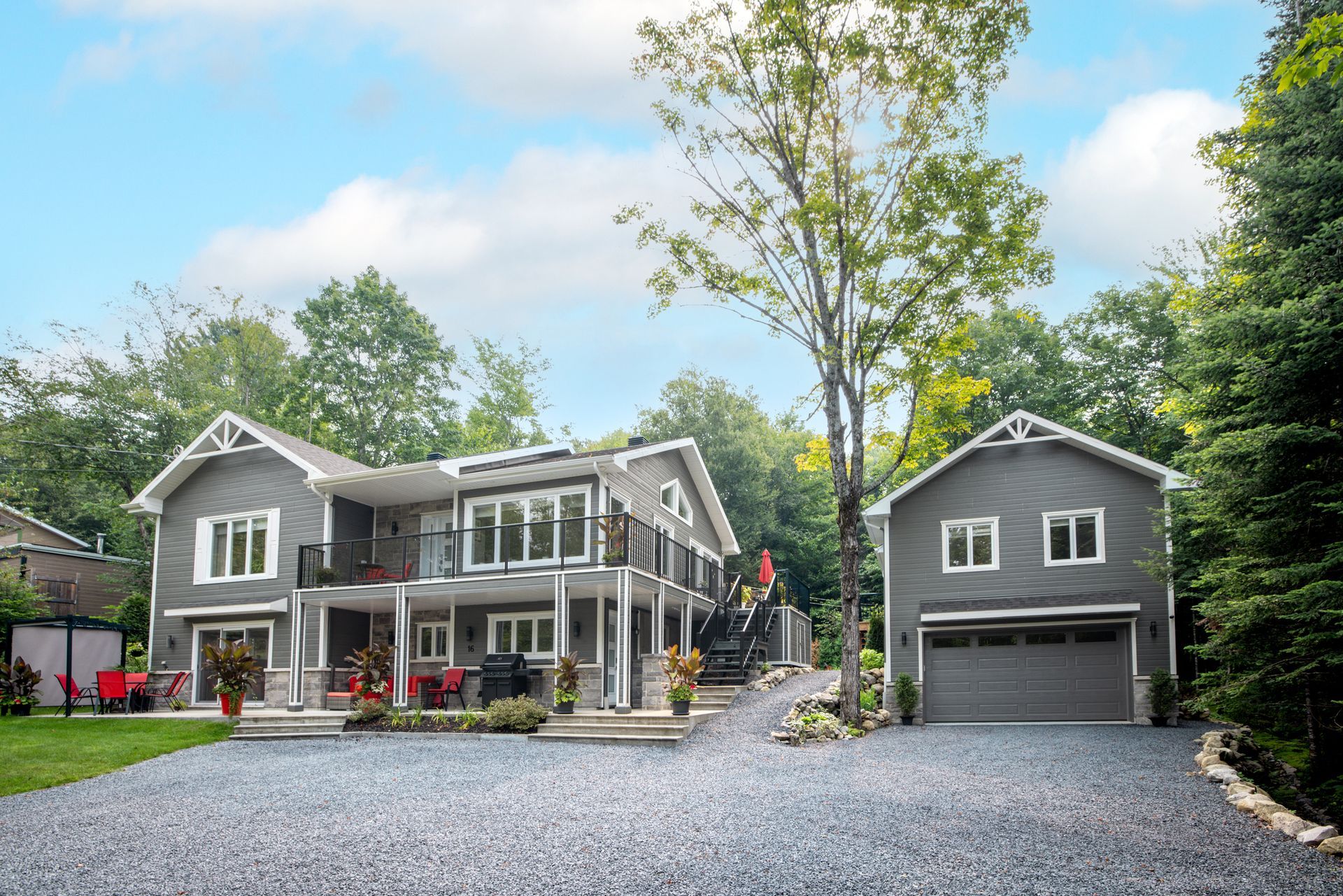 Gray and white property and detached garage, highlighting pre-built detached garage installation.