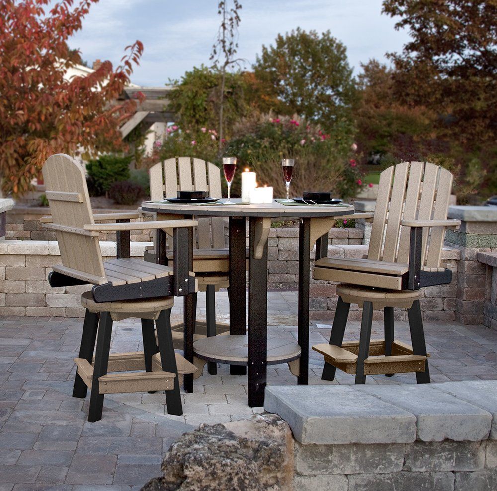 Outdoor bar set with tan and black chairs and table on a patio.